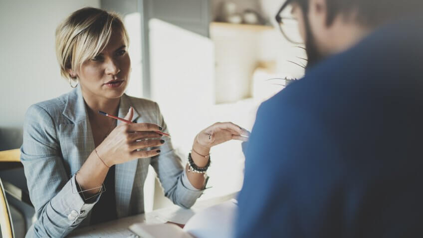 businesswoman being interviewed by man