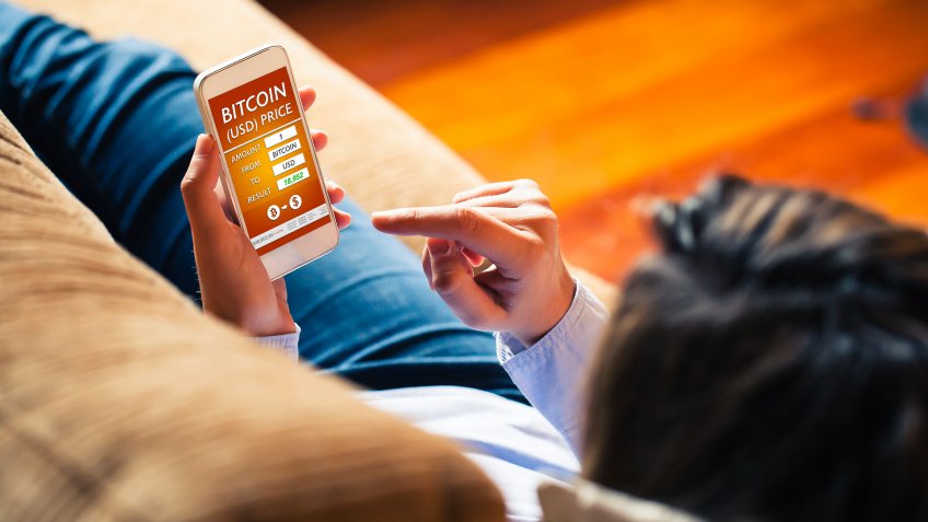 Bitcoin - Dollar converter app in a mobile phone screen.