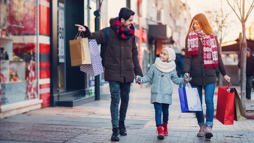 Family with one kid shopping together.