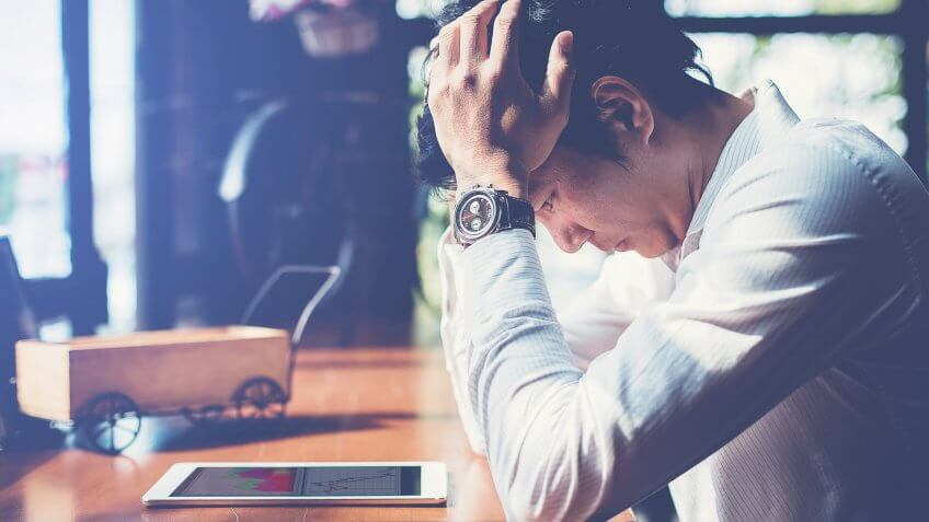 man feeling overwhelmed