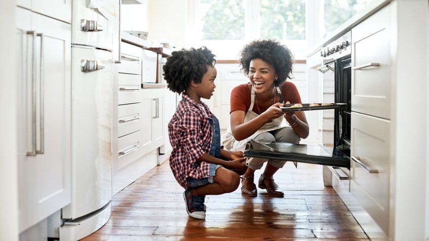 Shot of a mother and son baking together in the kitchen.