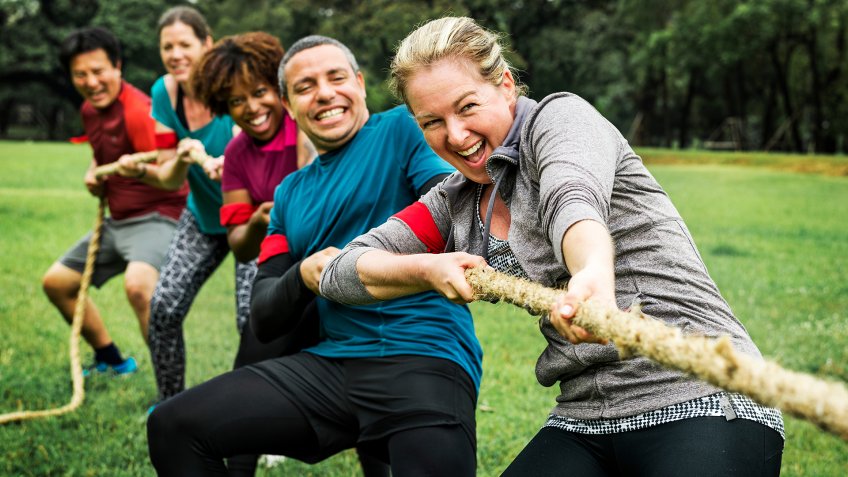 Team competing in tug of war - Image.