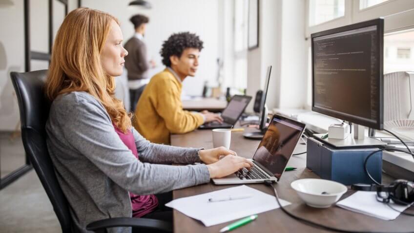 Female professional working on new software program.