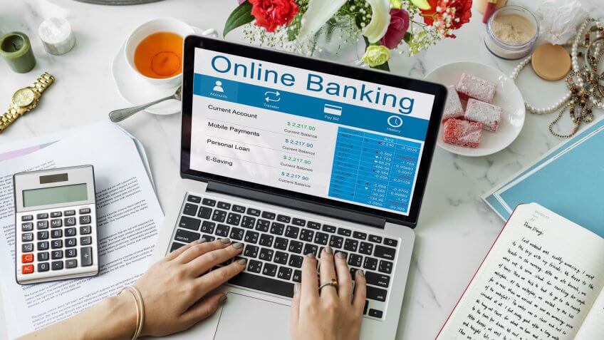 woman looking at balance on banking website