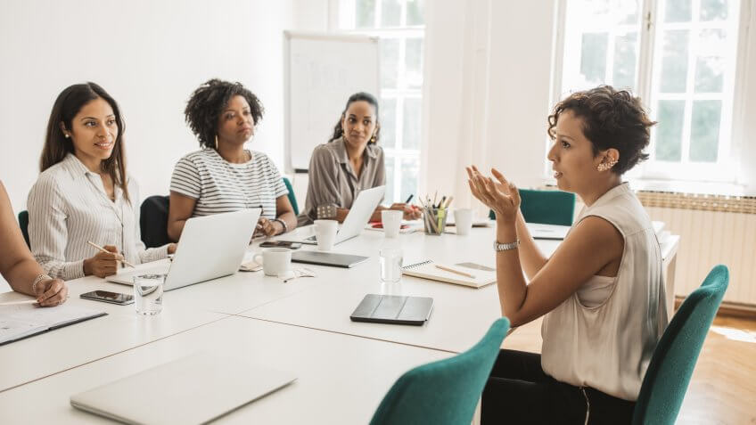 Group of latin women having a business meeting.