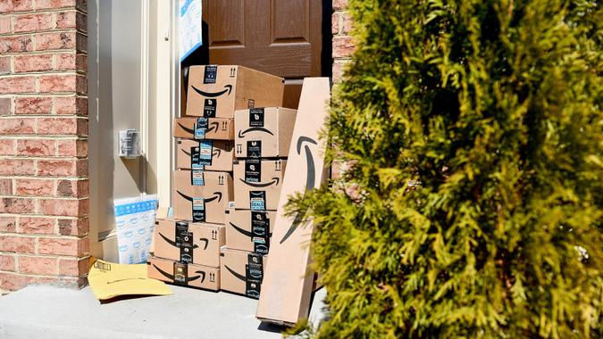 WASHINGTON DC, USA - MARCH 15, 2018: A large Amazon Prime delivery consisting of several packages delivered to the front door of a home.
