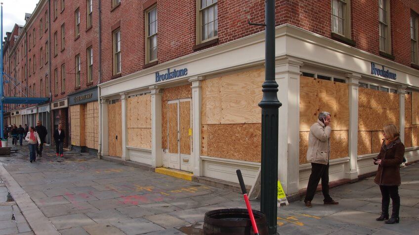 NEW YORK, NOVEMBER 3: Plywood covers storefronts at the South Street Seaport in New York City, November 3, 2012.