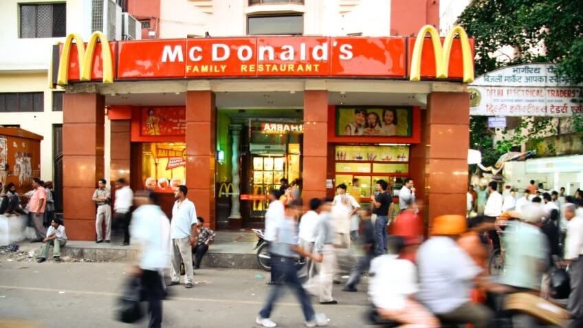 DELHI - SEPTEMBER 15: Crowds passing in front of McDonald's on September 15, 2007 in Delhi, India. It's the only country in the world that does not offer beef on its menu.