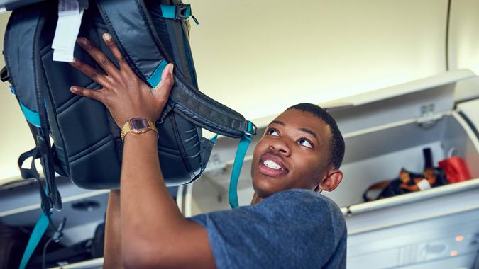 Shot of a young person in an airplane.