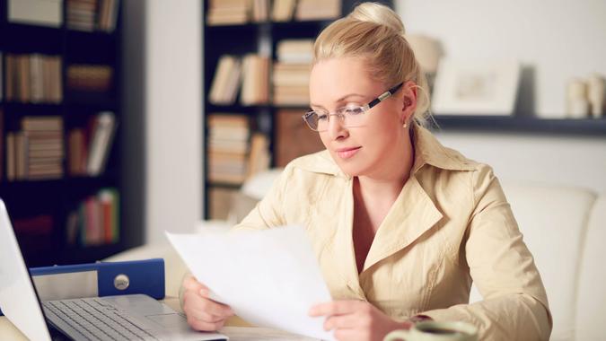 blonde woman working at home.
