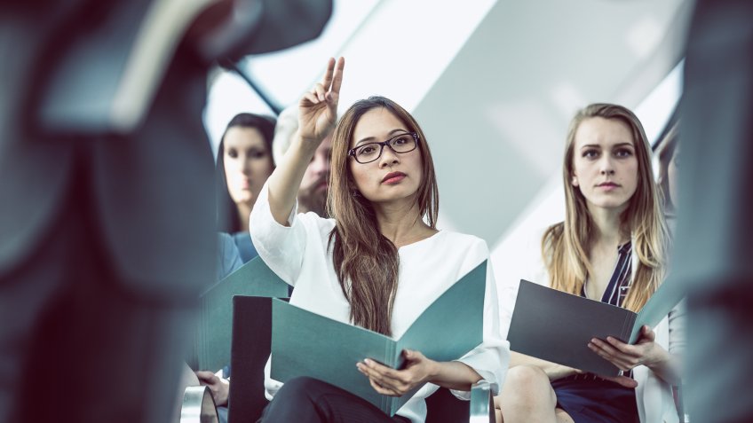Business People on a Conference Event Listening to the Speaker.
