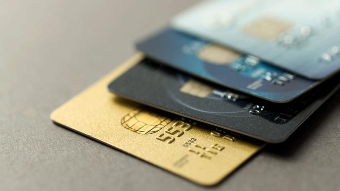 Close up of credit cards over grey background.