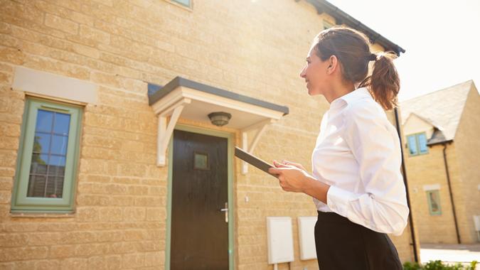 Female real estate investor looking at future home