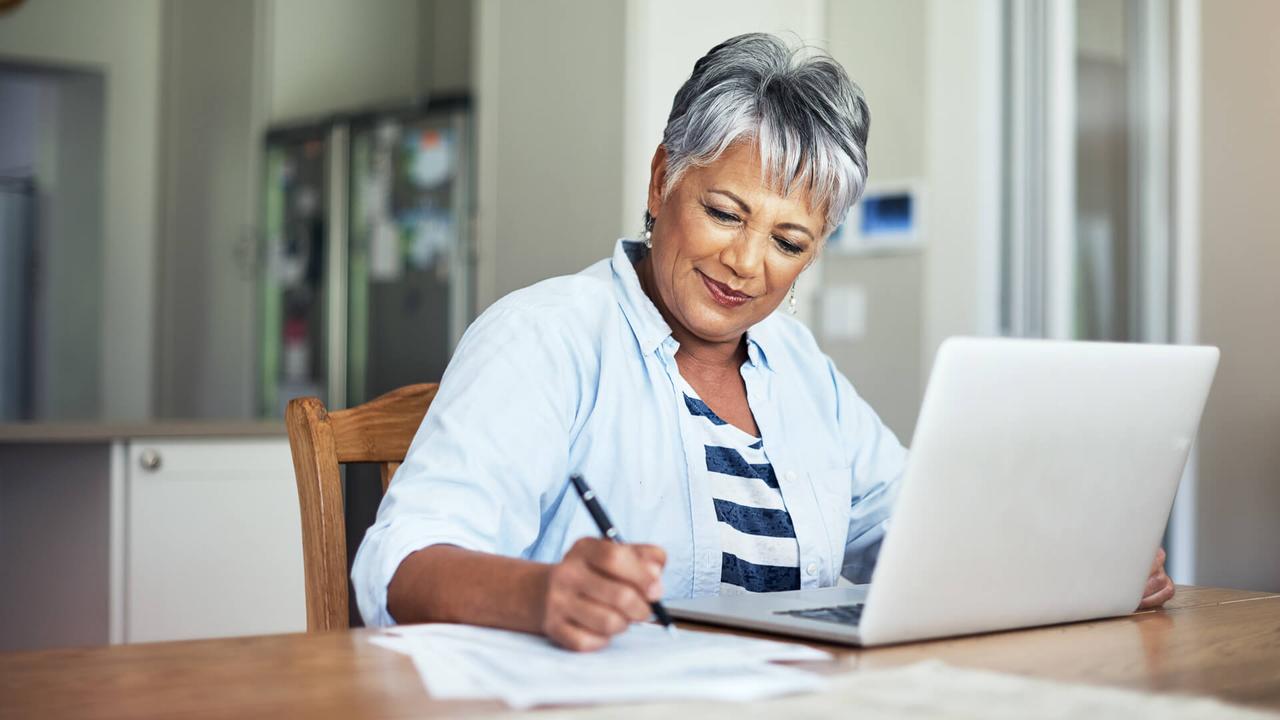 Cropped shot of a senior woman using a laptop to do the household finances.