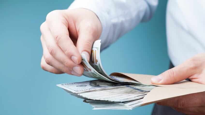 saving cash in an envelope