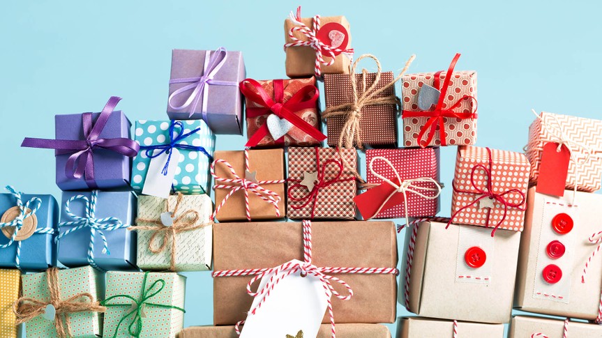 Collection of Christmas present boxes on a light blue background.