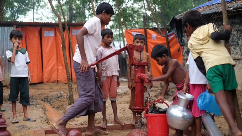 COX'S BAZAR, BANGLADESH : OCTOBER 8, 2017 - The Rohingyas took water in relief from non-governmental organizations (NGO) at the refugee camp in Kutupalong.