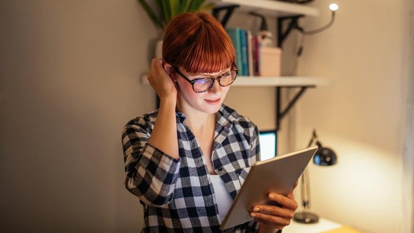 Portrait of a young businesswoman using digital tablet.