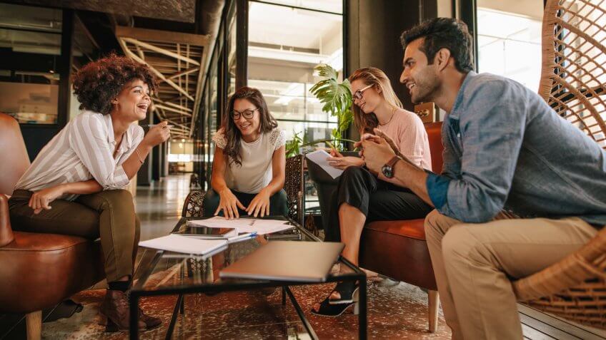 Group of businesspeople having a meeting in a modern office.
