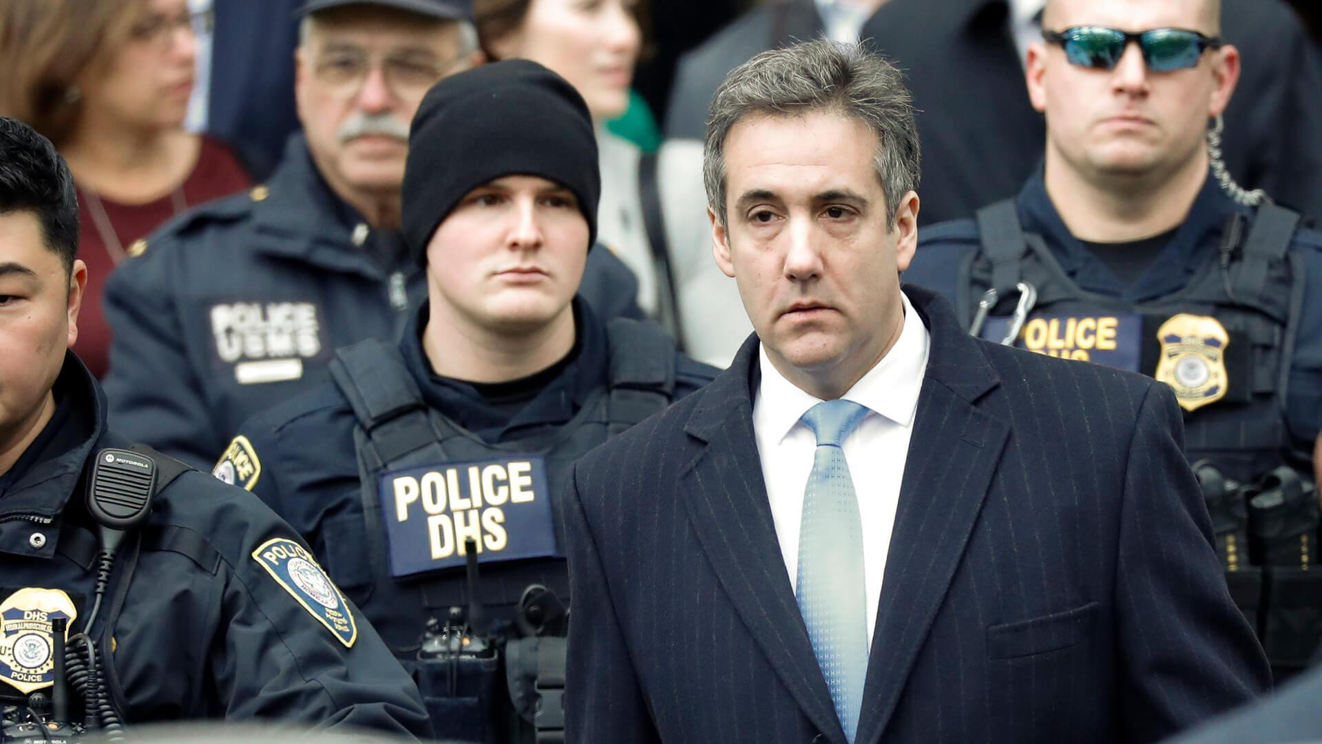 Mandatory Credit: Photo by JASON SZENES/EPA-EFE/REX/Shutterstock (10031563f)Michael Cohen (front -R), President Trump's former lawyer, departs United States Federal Court after being sentenced to three years in prison in New York, New York, USA, 12 December 2018.