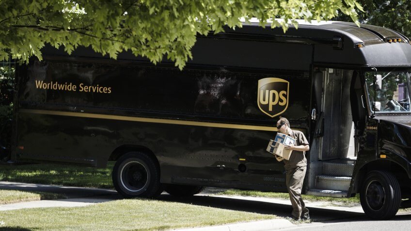 Rochester, Michigan, USA - June 08, 2016: A UPS driver making a delivery to a residence in Rochester.