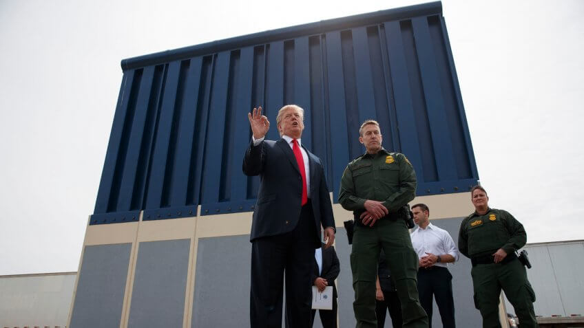Mandatory Credit: Photo by Evan Vucci/AP/REX/Shutterstock (9480348a)President Donald Trump talks with reporters as he reviews border wall prototypes in San Diego.
