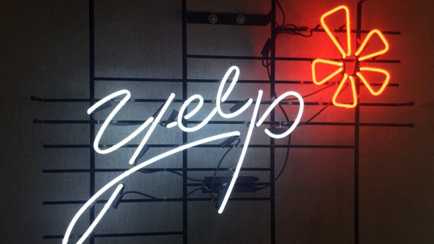 San Francisco,CA August 22 2018: Neon Lighting Yelp Internet Review company logo at Yelp Headquarters Cafateria.