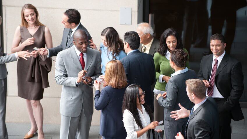 group of business folk / all networking together / to generate cash.