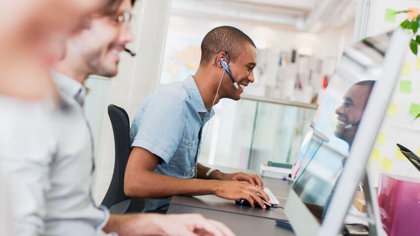 20-24 Years, 25-29 Years, 30-34 Years, African Ethnicity, Answering, Asian Ethnicity, Assistance, Business, Businessman, Businesswoman, Call Center, Casual Clothing, Chinese Ethnicity, Color Image, Communication, Computer, Convenience, Customer Service Representative, Day, Desk, Focus On Background, Hands-free Device, Head And Shoulders, Headset, Horizontal, Indoors, Internet, Latin American and Hispanic Ethnicity, Listening, London, Meeting, Mid Adult, Mid Adult Men, Multi-Ethnic Group, Office, On The Phone, Outsourcing, Photography, Reading, Service, Side View, Sitting, Talking, Technology, Telephone, Three People, Typing, UK, Watching, Working, Young Adult, Young Men, Young Women, co-worker, creative business, customer service, helping, man, people, phoning, sales, tech support, technical support, telemarketer, telemarketing, viewing, woman