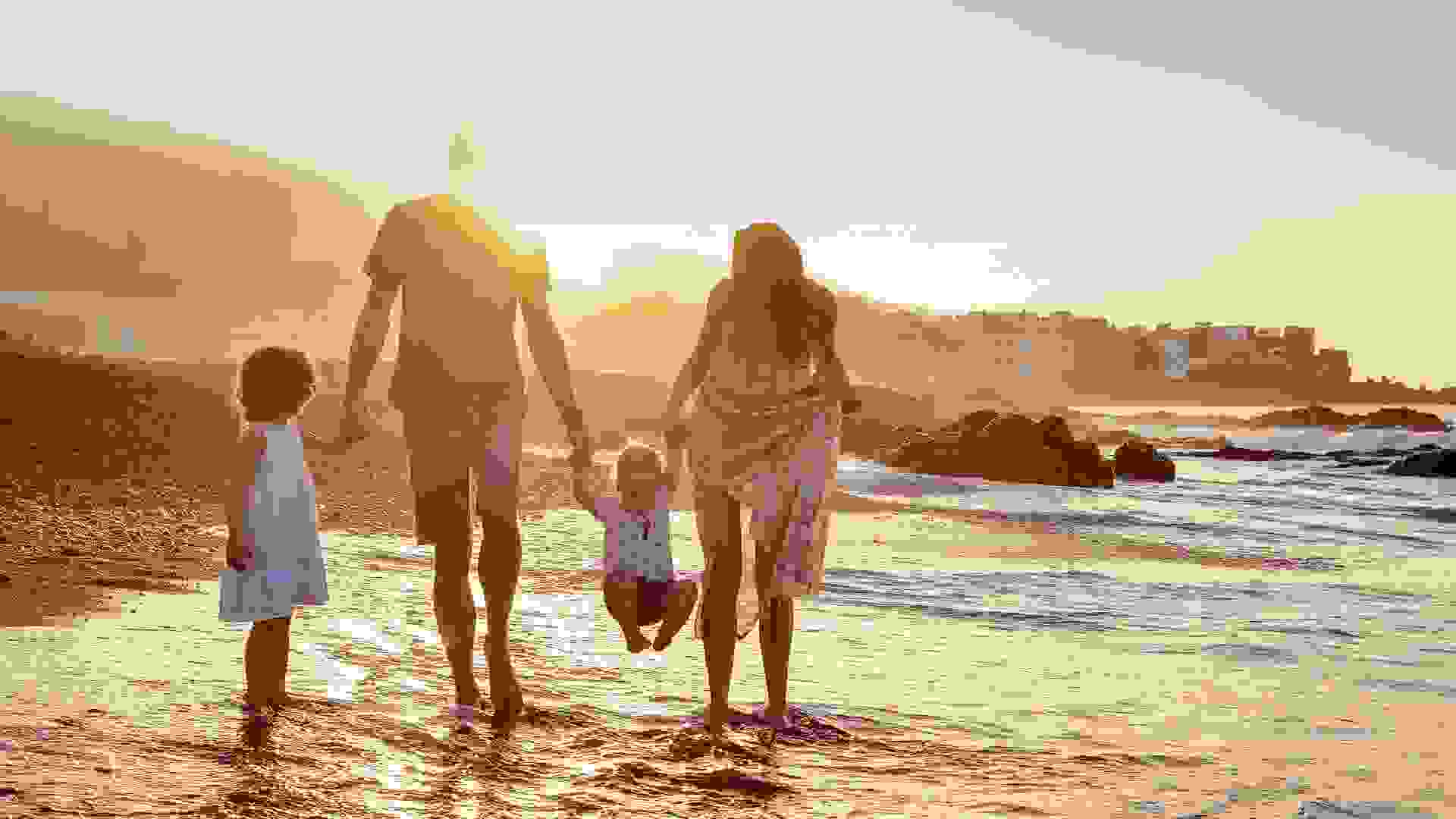 family of four on the beach