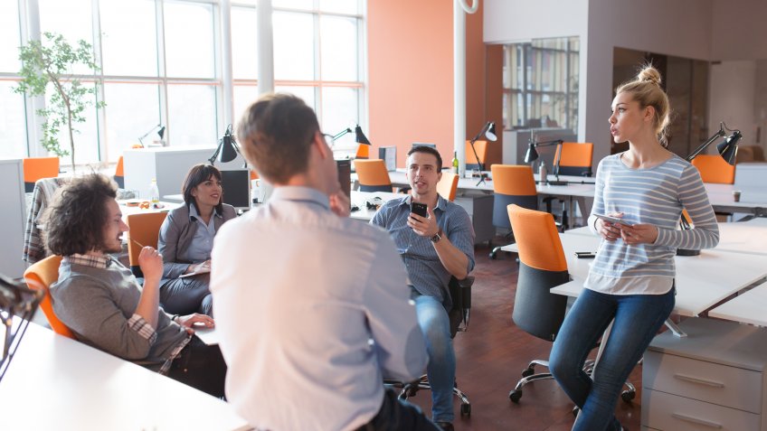 group of coworkers brainstorming in office