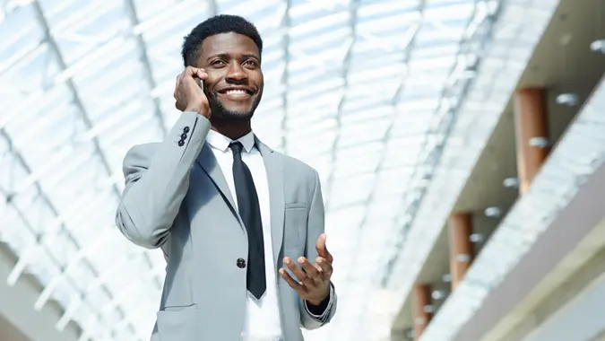 Successful manager talking on cellphone.