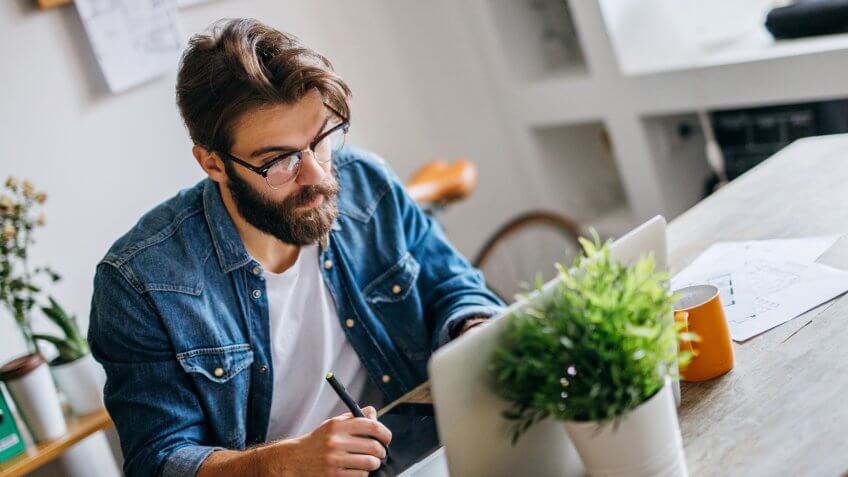 Creative man working in his modern home office.