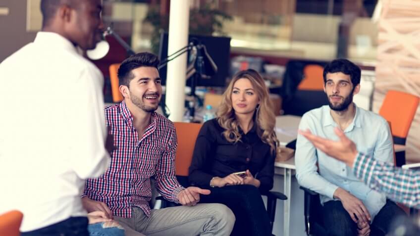 SMM specialists are discussing new creative concept for the new product marketing promotion.