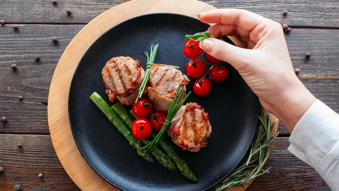 professional food stylist with dish