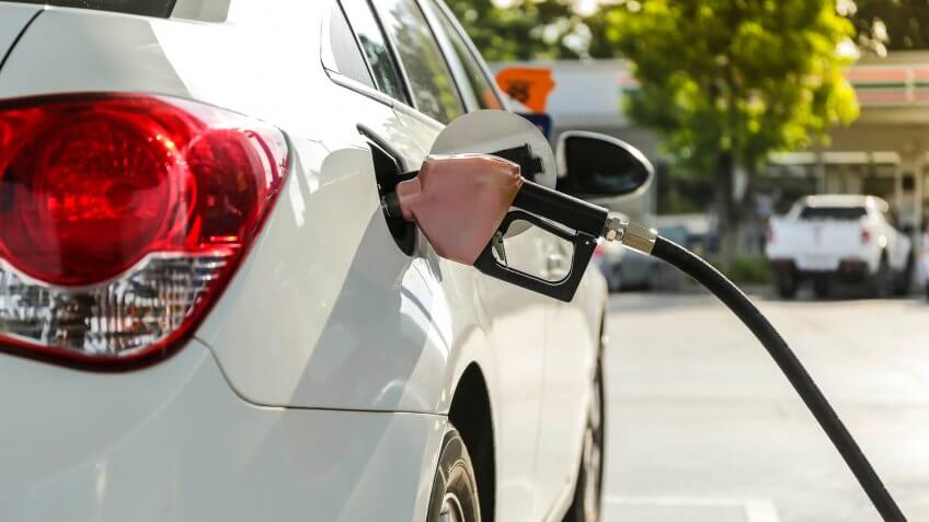 pumping gasoline into car