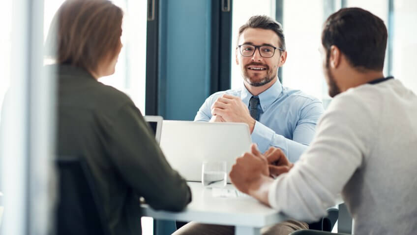 Shot of a group of businesspeople having a meeting in a modern office.