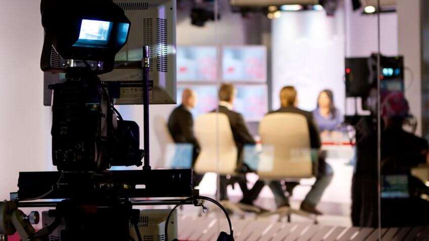 Recording live talk show at television studio.