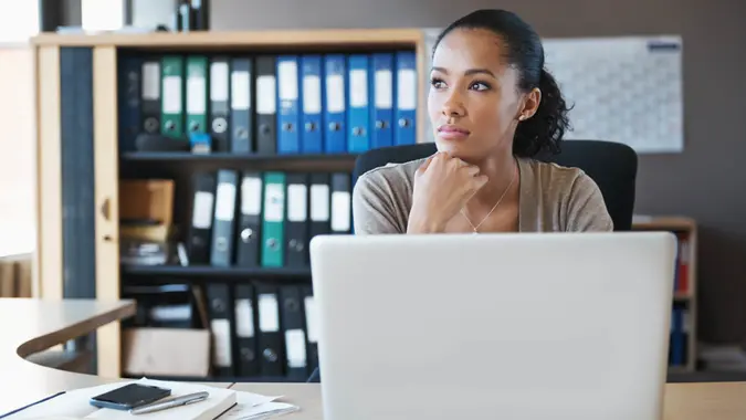 Shot of a businesswoman sitting behind her laptop in the office.