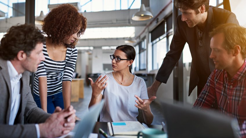 Shot of a group of coworkers brainstorming during a meetinghttp://195.