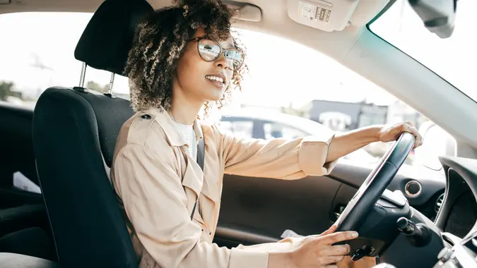 Young woman driving her car.