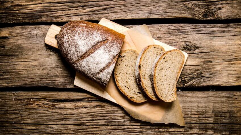artisanal bread on wood cutting board