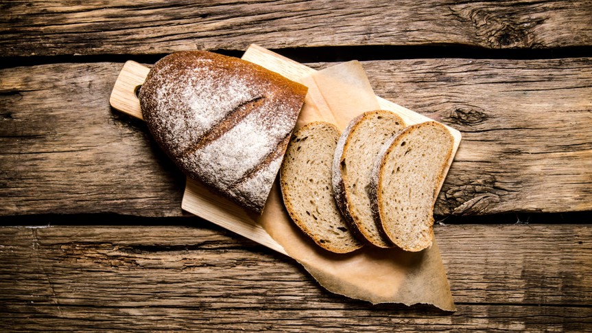 artisanal bread on wood cutting board