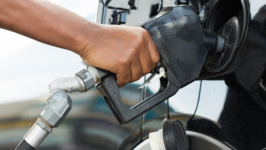 pumping gas into fuel tank