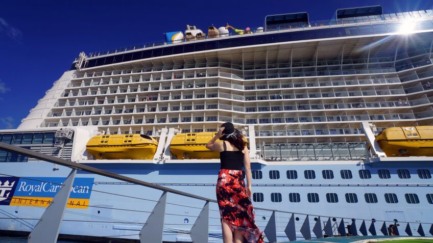 Fort-de-France, Martinique - April 23, 2017: On Pier, a woman is looking at Anthem of the Seas cruise ship.