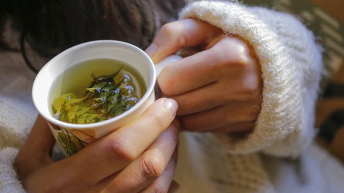 12 hand holding warm herbal tea Feyyaz Alacam-shutterstock_358214093 10980, Horizontal