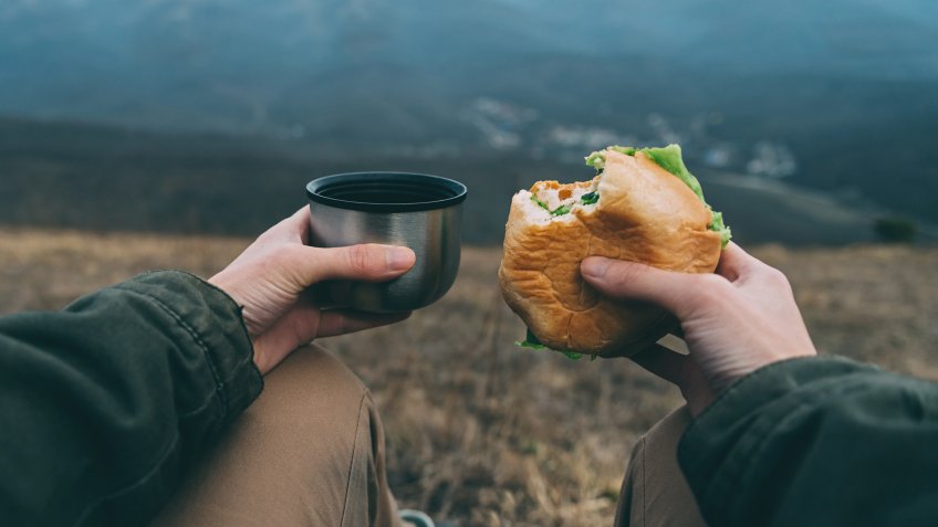 eating a sandwich while hiking