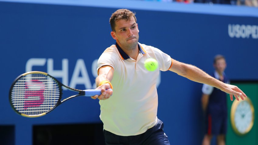 NEW YORK - AUGUST 27, 2018: Professional tennis player Grigor Dimitrov of Bulgaria in action during first round match at 2018 US Open at USTA National Tennis Center - Image.