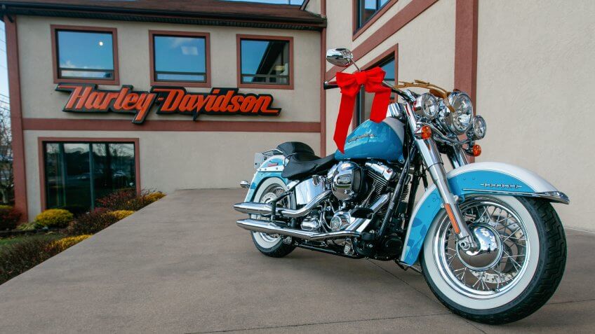 Absecon, NJ, December 10, 2016: Brand new light blue motorcycle with some Christmas decorations is seen on display just outside of a Harley-Davidson dealer.