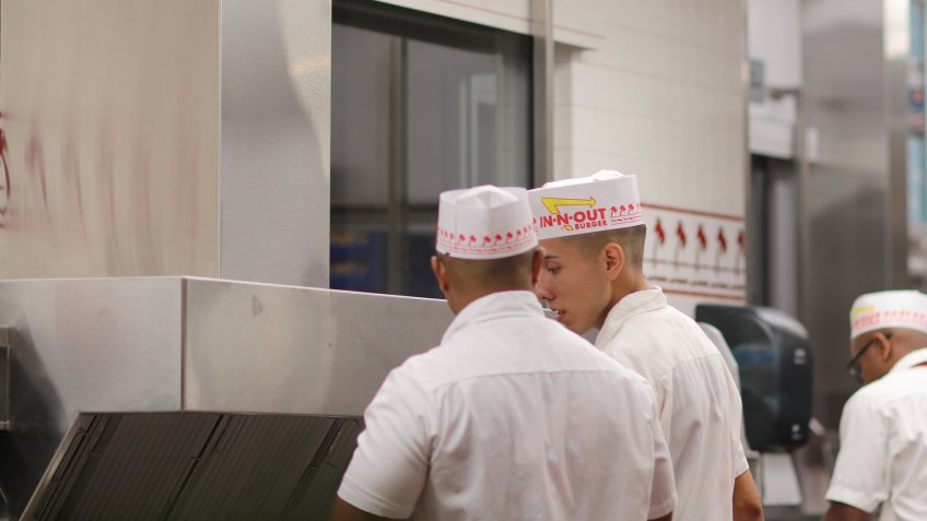 In-N-Out manager speaking with employee